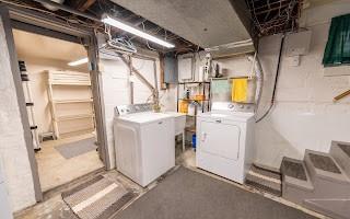 228 Clover Street Pittsburgh, PA 15210 - Photo 29 of 46 a utility room with cabinets dryer and washer