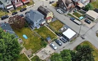 228 Clover Street Pittsburgh, PA 15210 - Photo 43 of 46 an aerial view of a house with a garden and swimming pool