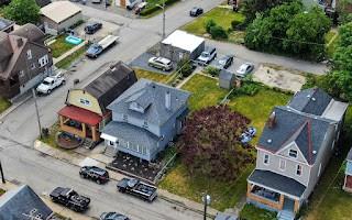 228 Clover Street Pittsburgh, PA 15210 - Photo 46 of 46 an aerial view of residential house with outdoor space and parking