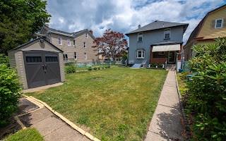 228 Clover Street Pittsburgh, PA 15210 - Photo 5 of 46 a front view of a house with garden