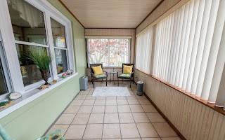 228 Clover Street Pittsburgh, PA 15210 - Photo 10 of 46 a hallway with a large window and sitting area