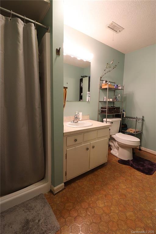4693 Cureton Ferry Road Catawba, SC 29704 - Photo 22 of 25 a room with a sink vanity and a mirror