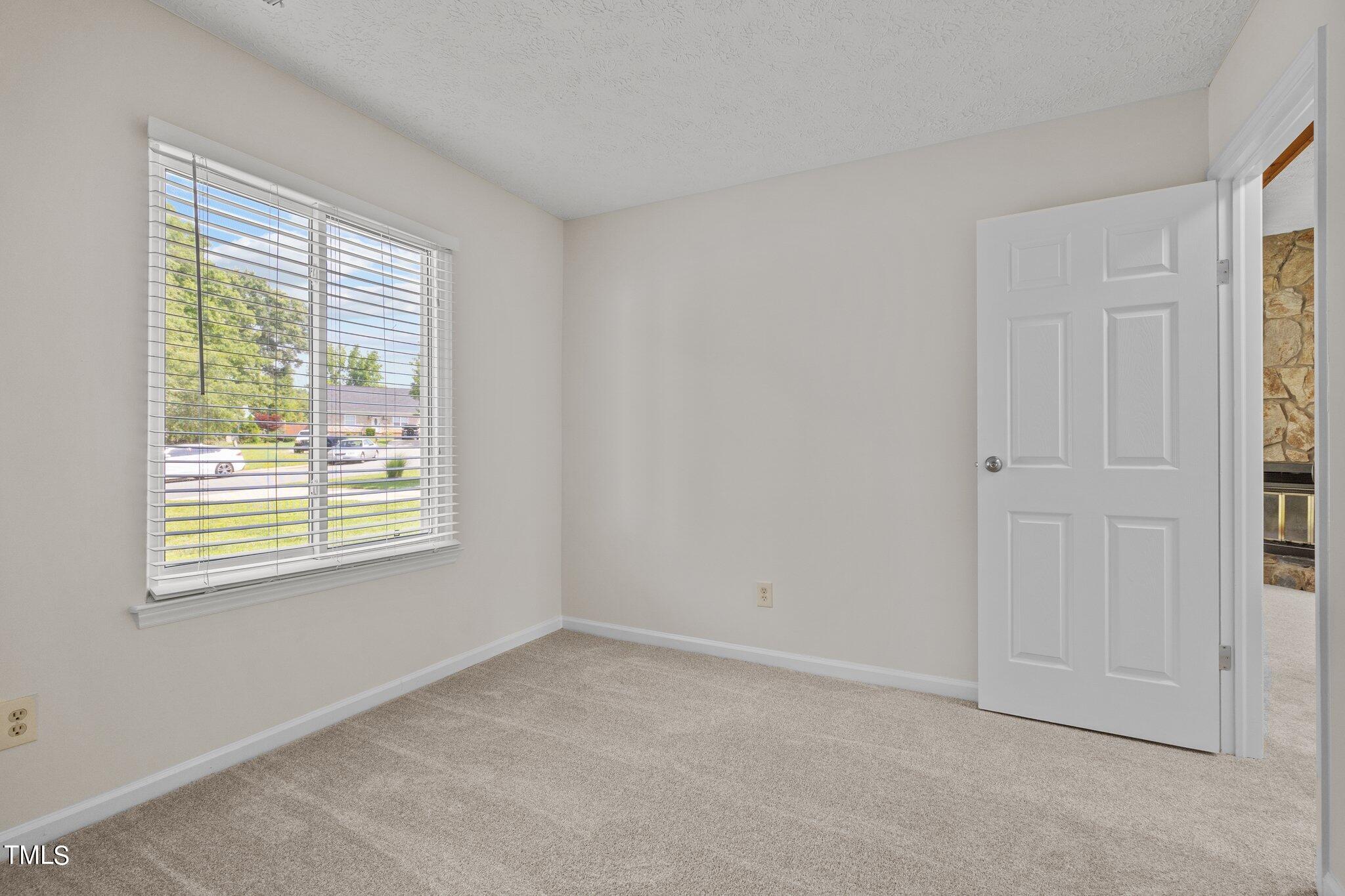 5104 Duckworth Court Raleigh, NC 27616 - Photo 15 of 36 a view of an empty room with a window
