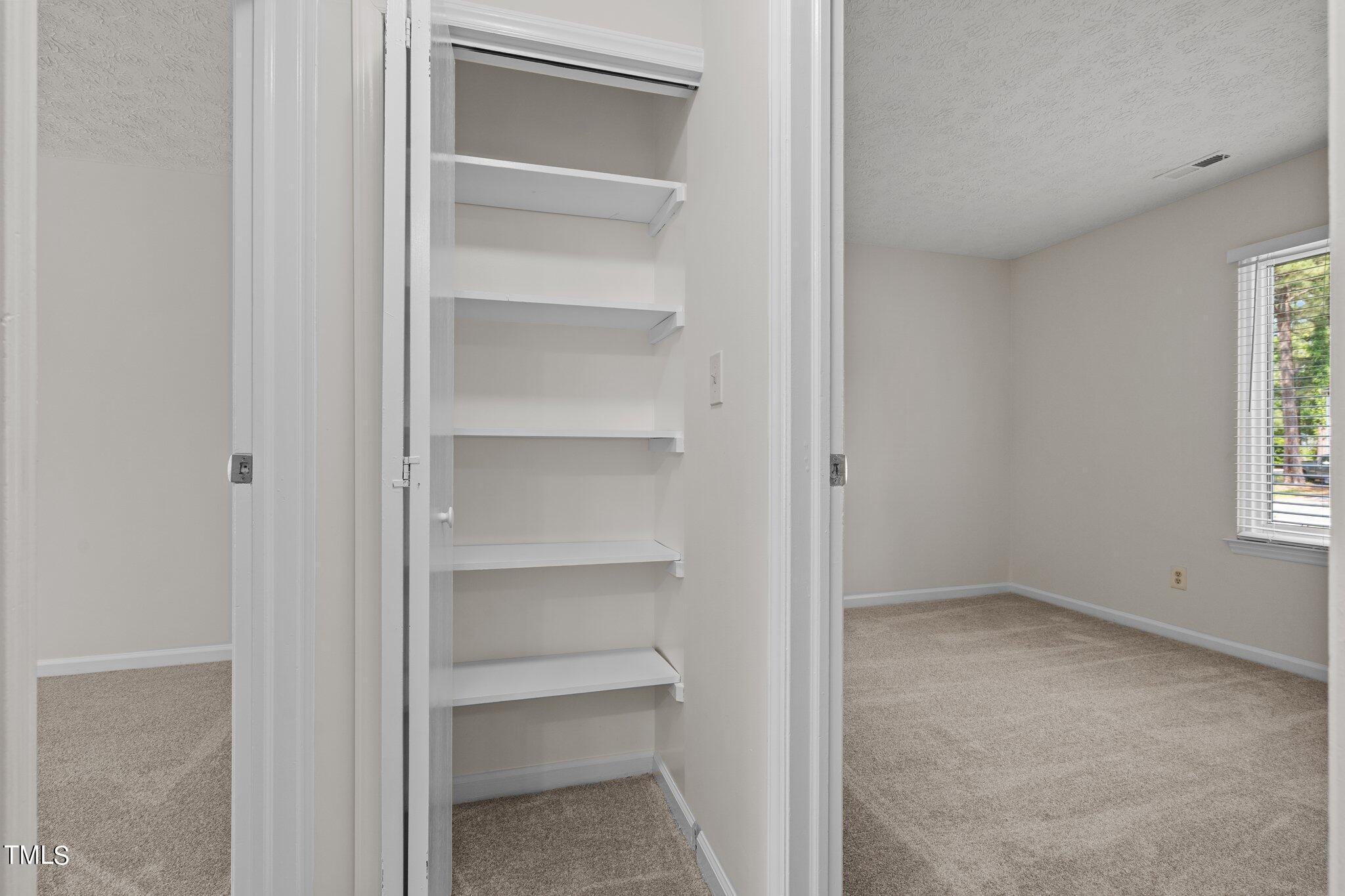5104 Duckworth Court Raleigh, NC 27616 - Photo 20 of 36 a view of an empty room with a closet