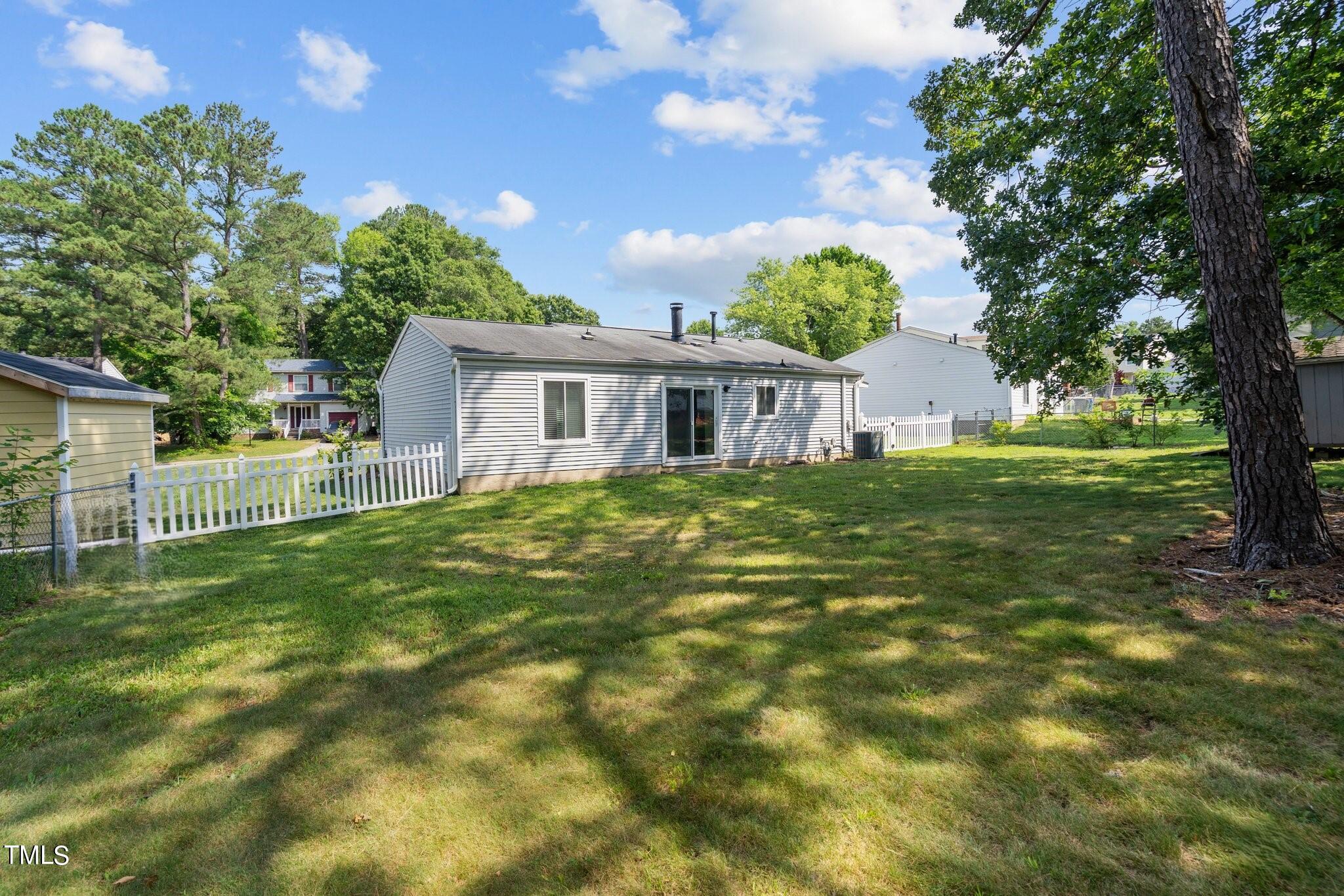 5104 Duckworth Court Raleigh, NC 27616 - Photo 2 of 36 a view of a house with a yard