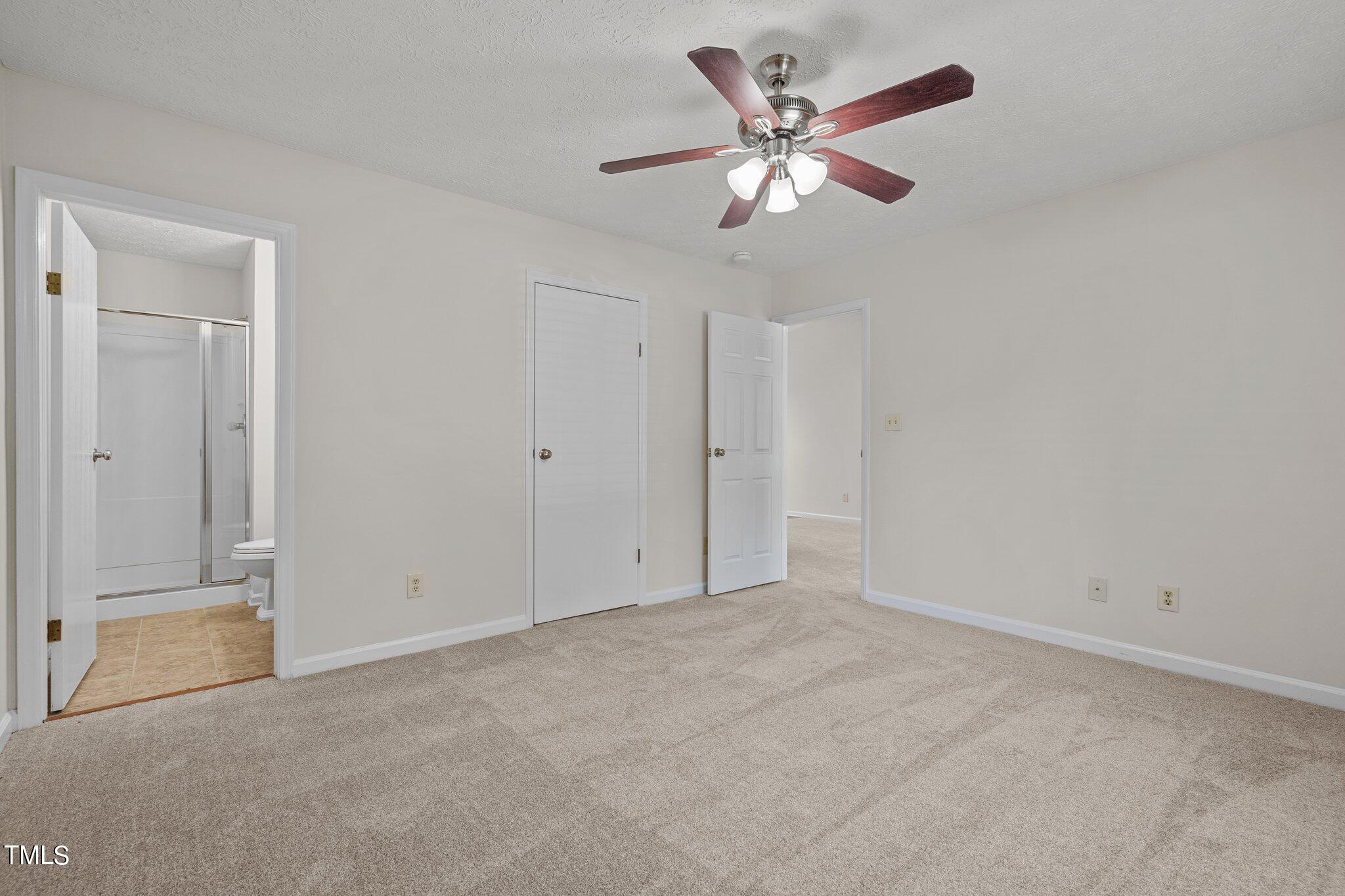 5104 Duckworth Court Raleigh, NC 27616 - Photo 23 of 36 an empty room with closet and fan