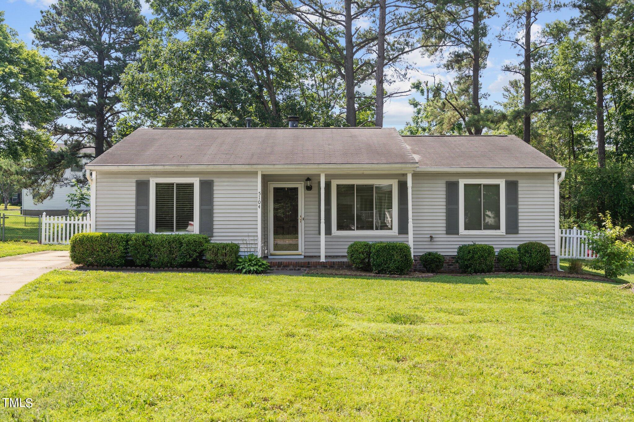5104 Duckworth Court Raleigh, NC 27616 - Photo 27 of 36 a front view of house with yard and green space