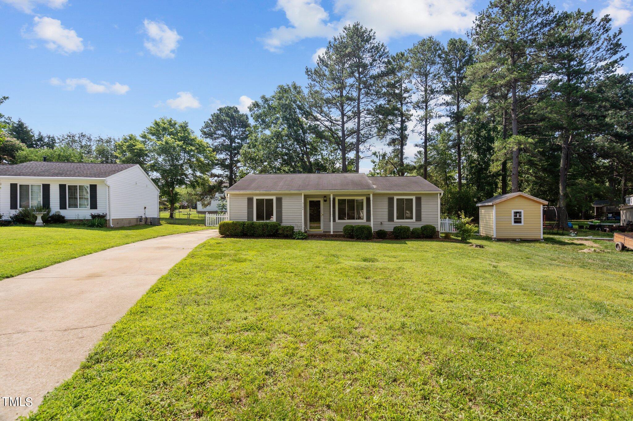 5104 Duckworth Court Raleigh, NC 27616 - Photo 28 of 36 a front view of house with yard and green space