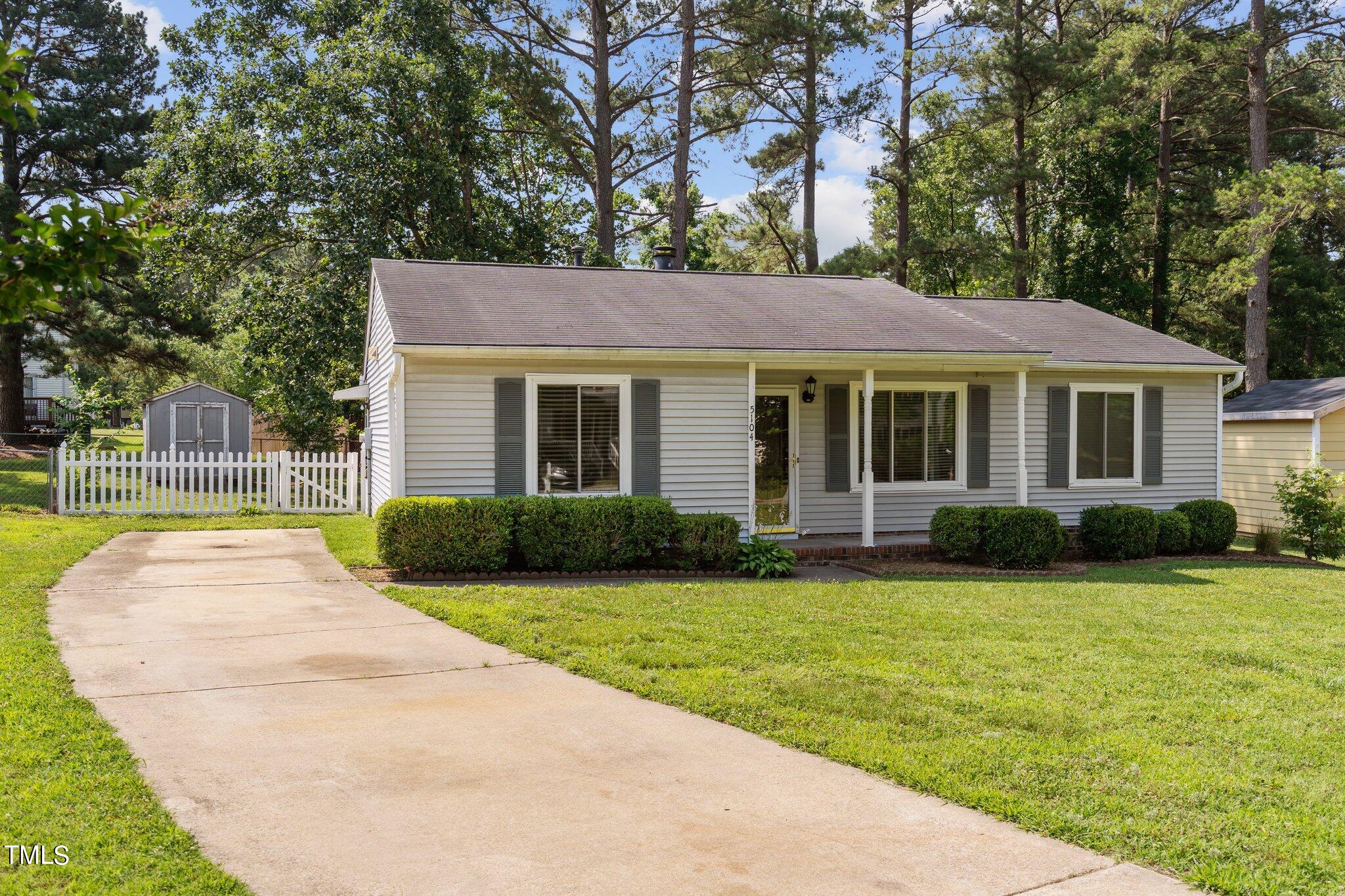 5104 Duckworth Court Raleigh, NC 27616 - Photo 29 of 36 a view of a house with a backyard