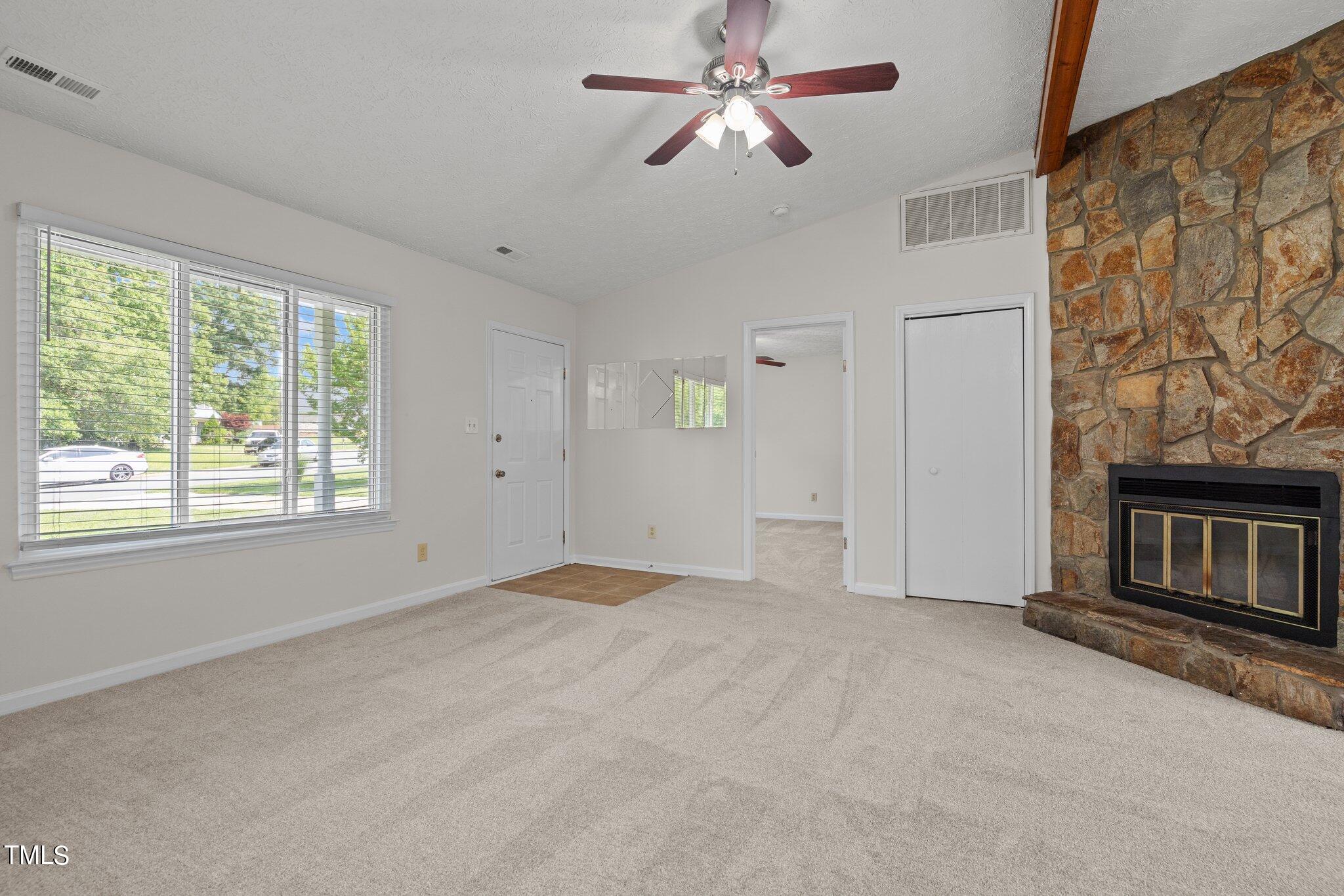 5104 Duckworth Court Raleigh, NC 27616 - Photo 4 of 36 a view of empty room with ceiling fan