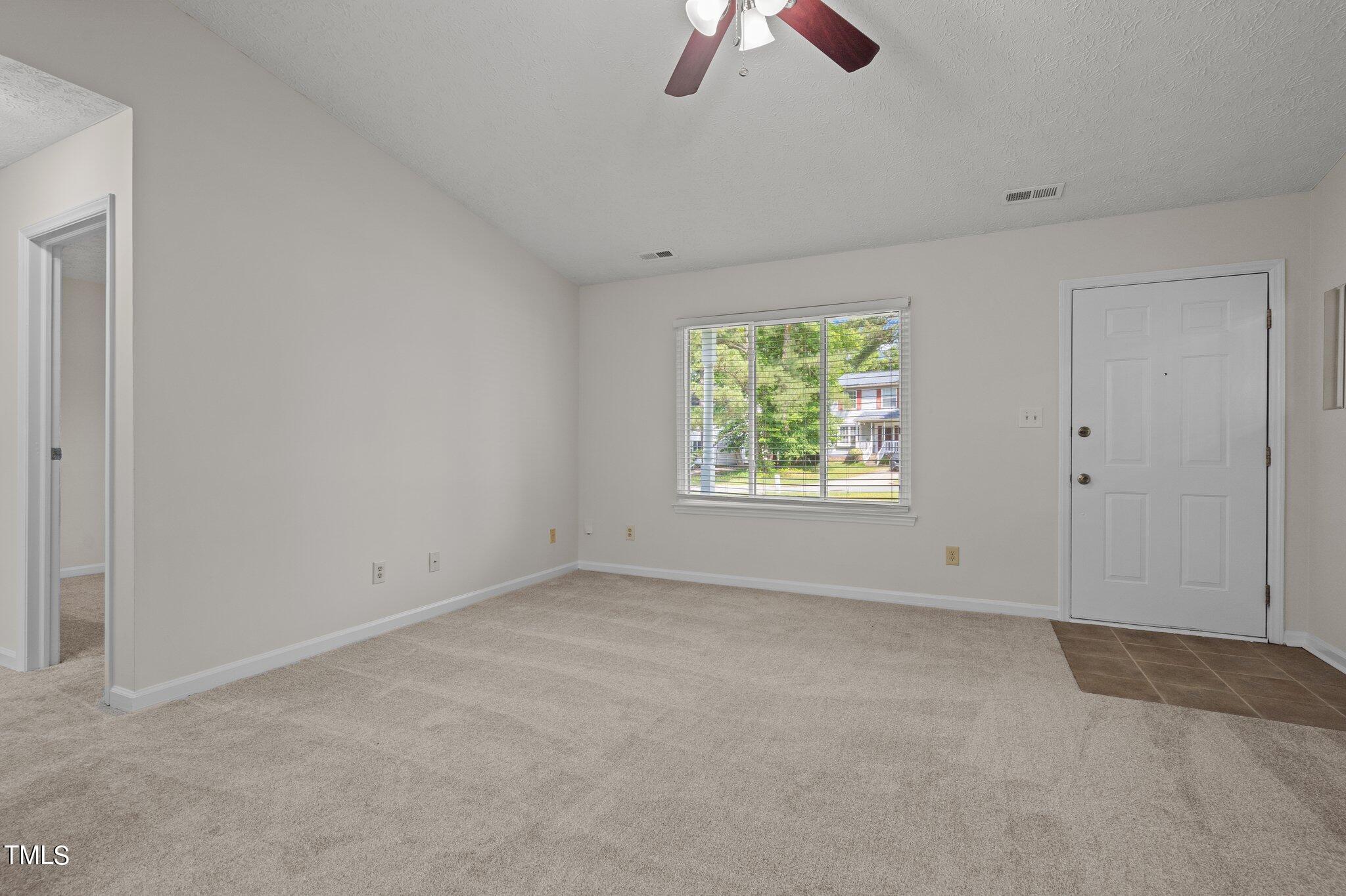 5104 Duckworth Court Raleigh, NC 27616 - Photo 7 of 36 an empty room with windows
