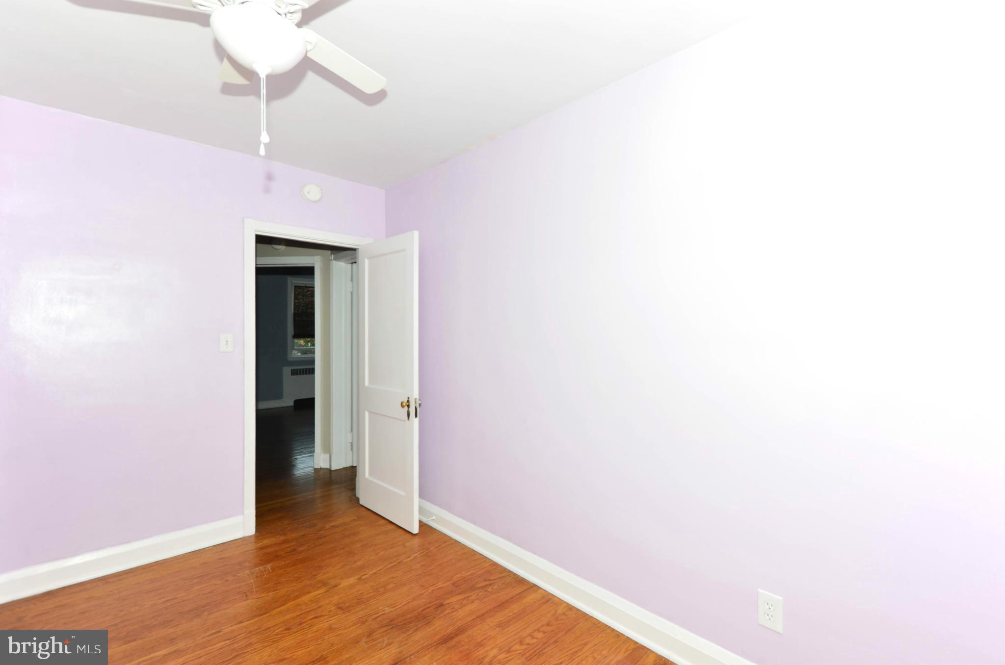 5226 Cromarty Road Baltimore, MD 21229 - Photo 22 of 30 a view of a room with wooden floor and fan