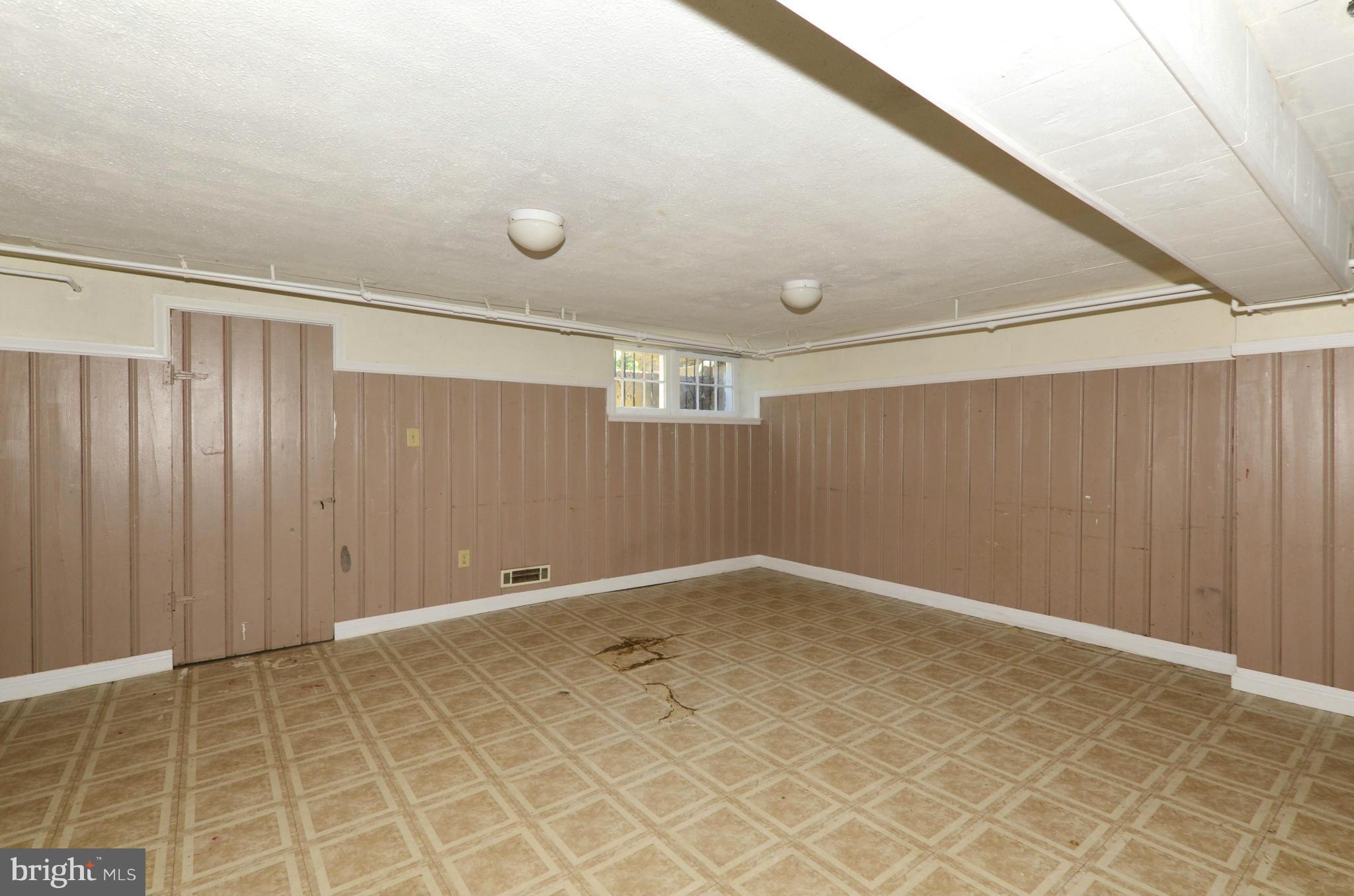 5226 Cromarty Road Baltimore, MD 21229 - Photo 29 of 30 an empty room with a empty space and windows
