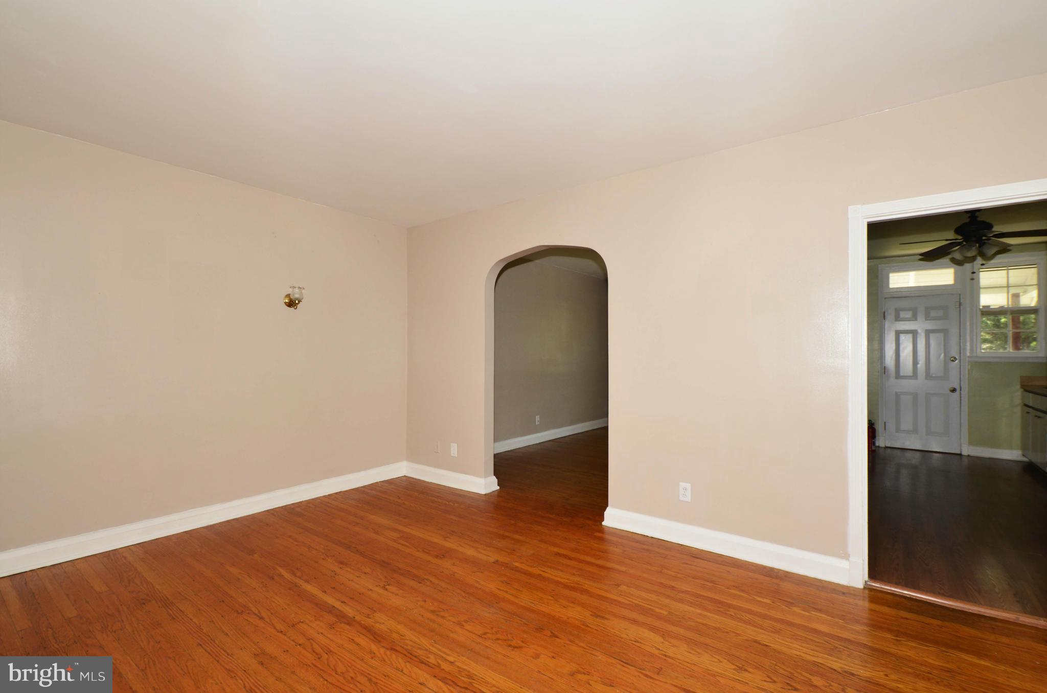 5226 Cromarty Road Baltimore, MD 21229 - Photo 4 of 30 an empty room with wooden floor and closet