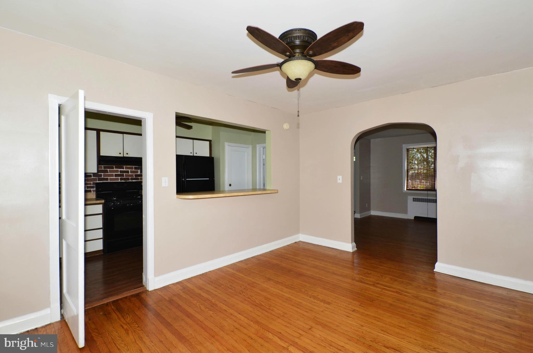 5226 Cromarty Road Baltimore, MD 21229 - Photo 8 of 30 wooden floor in an empty room with a window