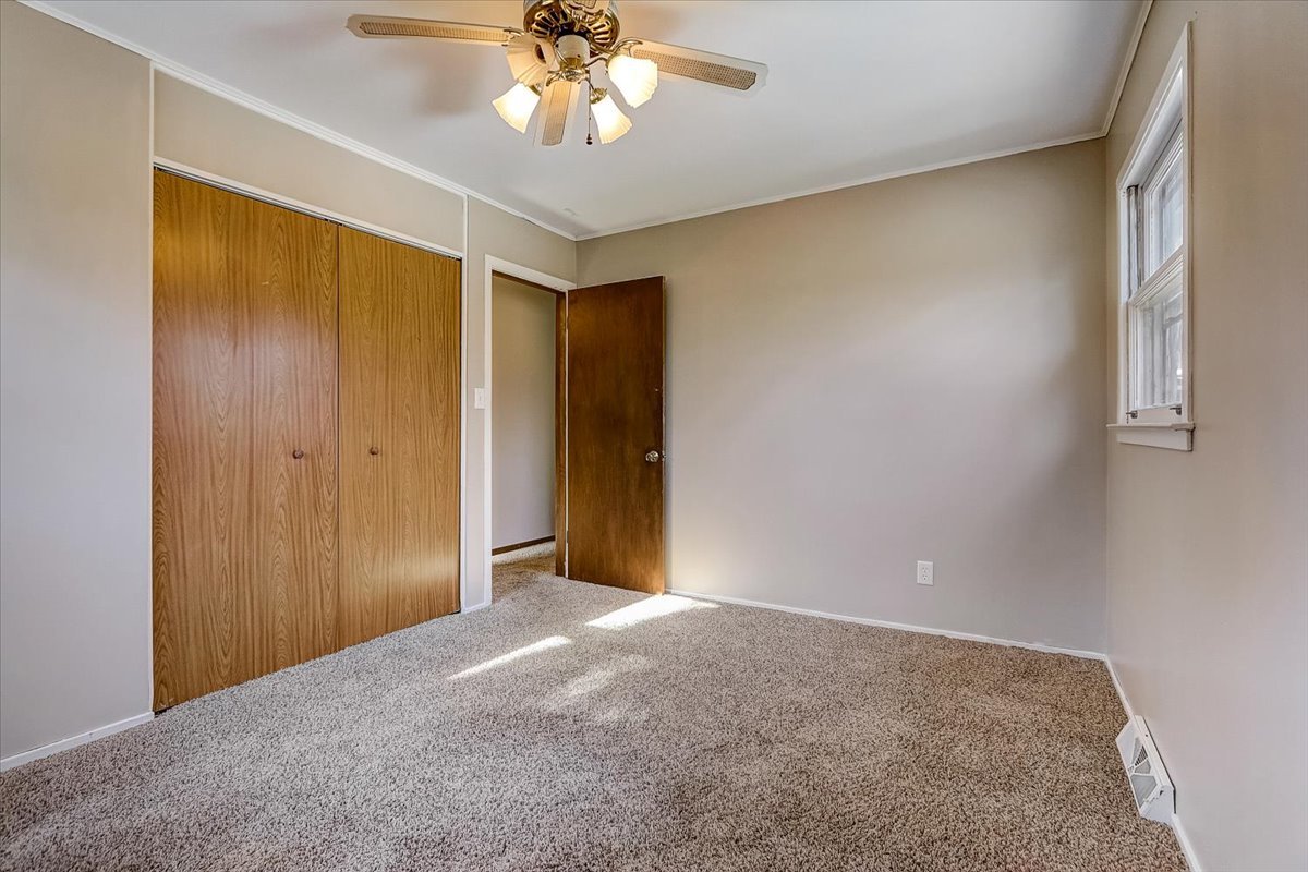 406 Kent Road McHenry, IL 60051 - Photo 14 of 39 a view of an empty room with a chandelier fan