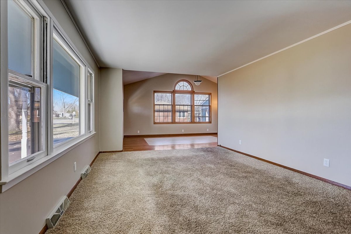 406 Kent Road McHenry, IL 60051 - Photo 3 of 39 an empty room with windows