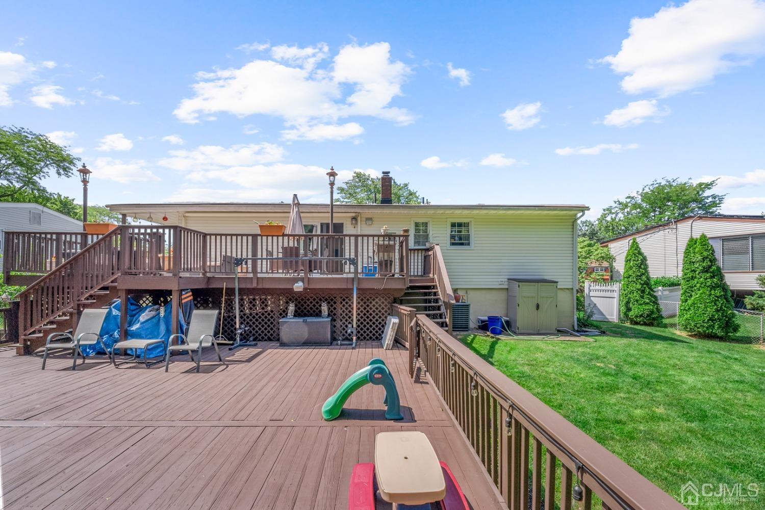 78 Wilk Road Edison, NJ 08837 - Photo 50 of 55 a view of house with swimming pool outdoor seating and city view