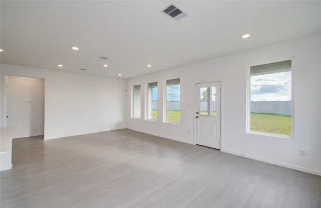 an empty room with windows