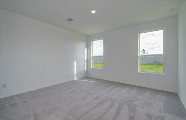 an empty room with windows