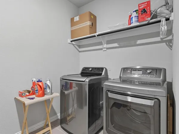 a utility room with dryer and washer