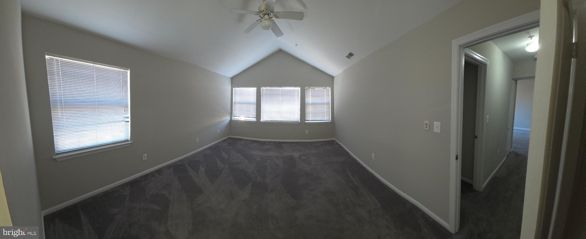 Spacious room with natural light and charm.