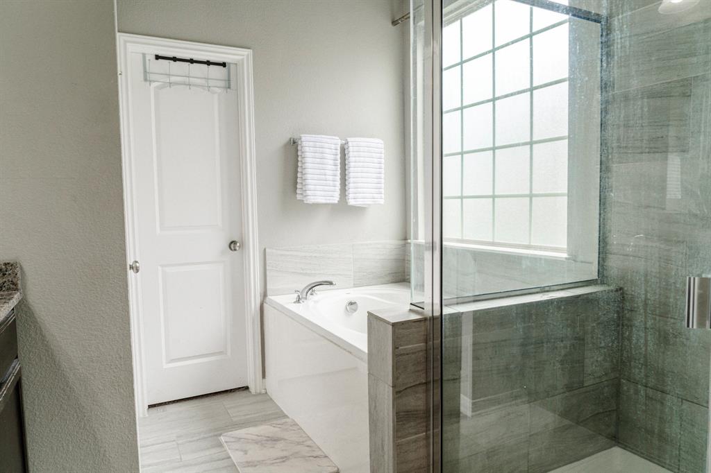 2716 Beutel Road Lorena, TX 76655 - Photo 18 of 39 a bathroom with a sink mirror and shower