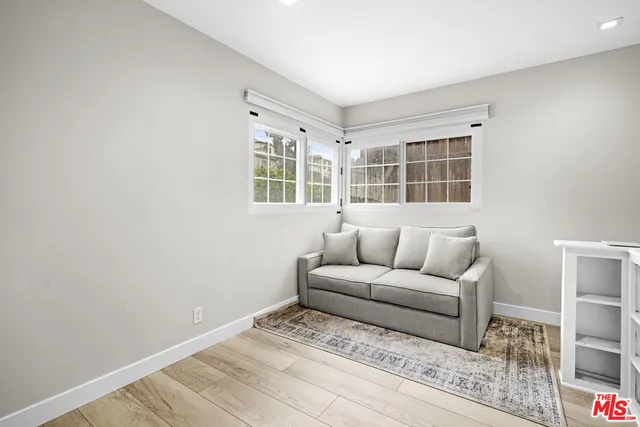 a living room with furniture and windows
