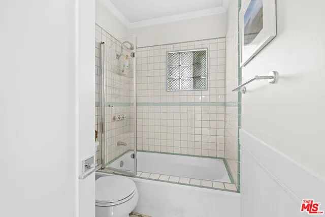 a bathroom with a shower and a toilet