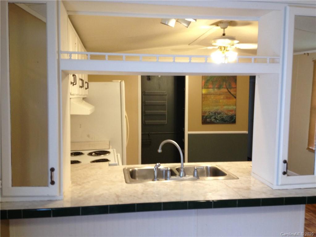 1562 Dunlap Roddey Road Rock Hill, SC 29730 - Photo 2 of 14 a bathroom with a granite countertop sink and a mirror