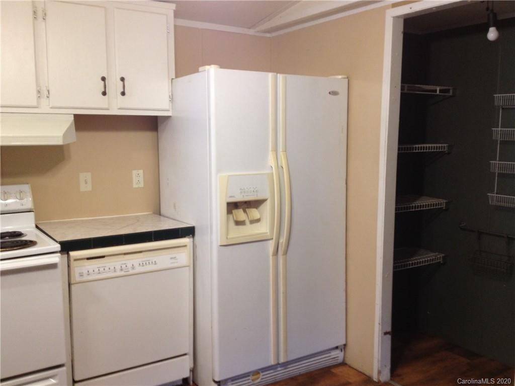 1562 Dunlap Roddey Road Rock Hill, SC 29730 - Photo 3 of 14 a white refrigerator freezer and a stove sitting inside of a kitchen