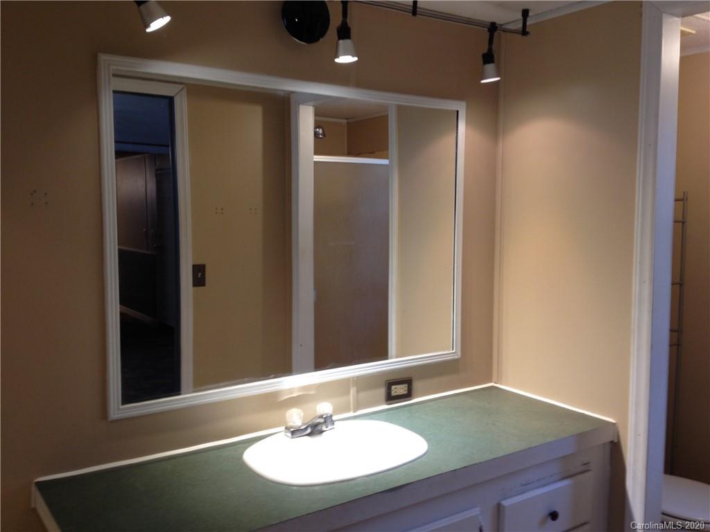1562 Dunlap Roddey Road Rock Hill, SC 29730 - Photo 10 of 14 a bathroom with a sink and a mirror