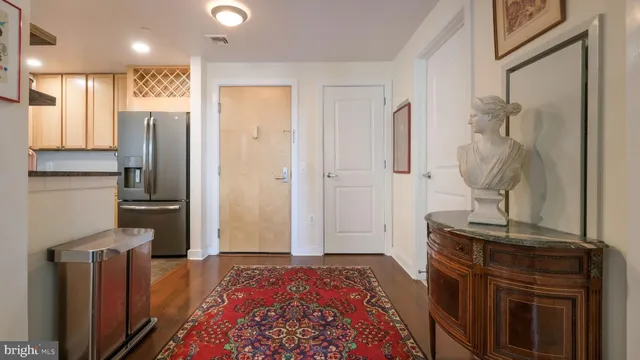 a bedroom with a bed and a mirror