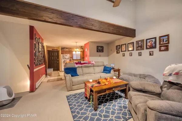 a living room with furniture and a rug
