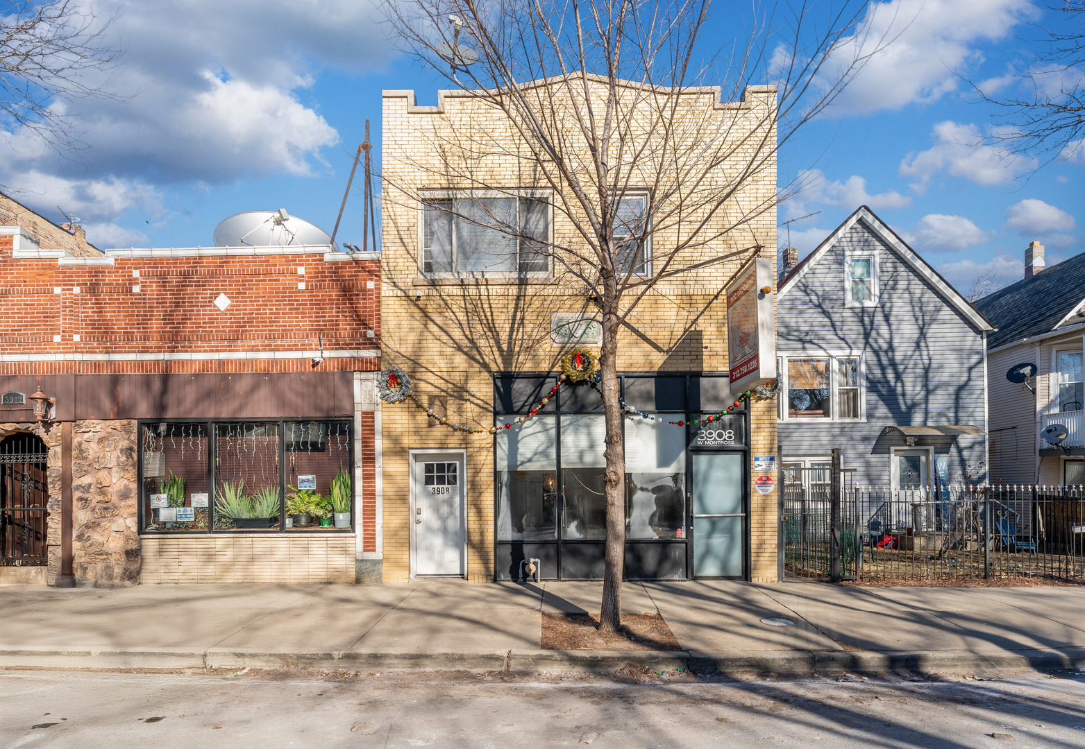 3908 West Montrose Avenue, Unit 2R Chicago, IL 60618 - Photo 1 of 10 a view of a brick building next to a road