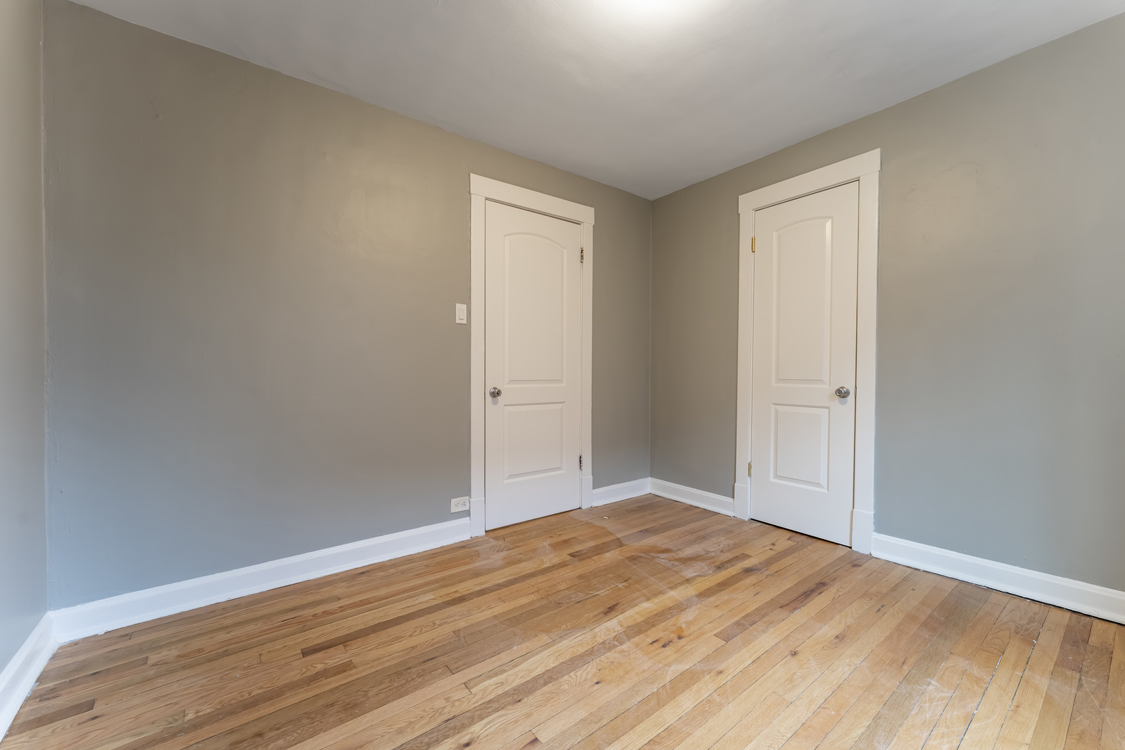 3908 West Montrose Avenue, Unit 2R Chicago, IL 60618 - Photo 10 of 10 a view of empty room with wooden floor