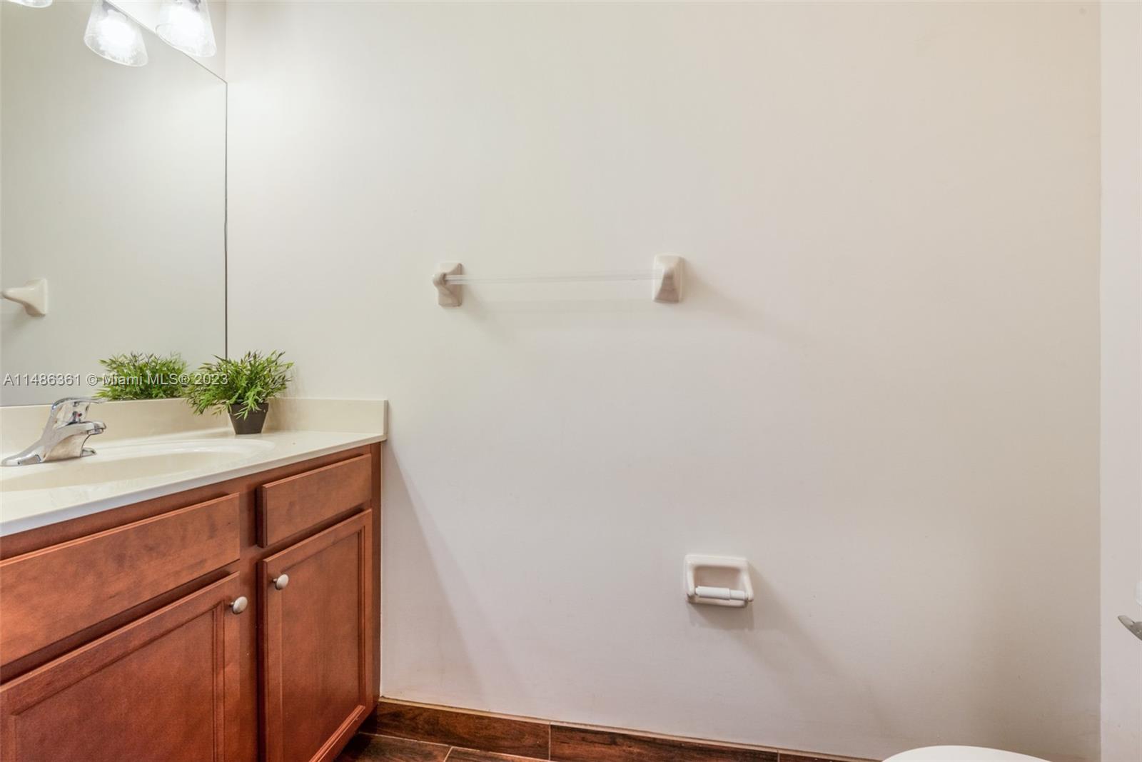15218 Southwest 173rd Lane Miami, FL 33187 - Photo 11 of 14 a bathroom with a sink and vanity