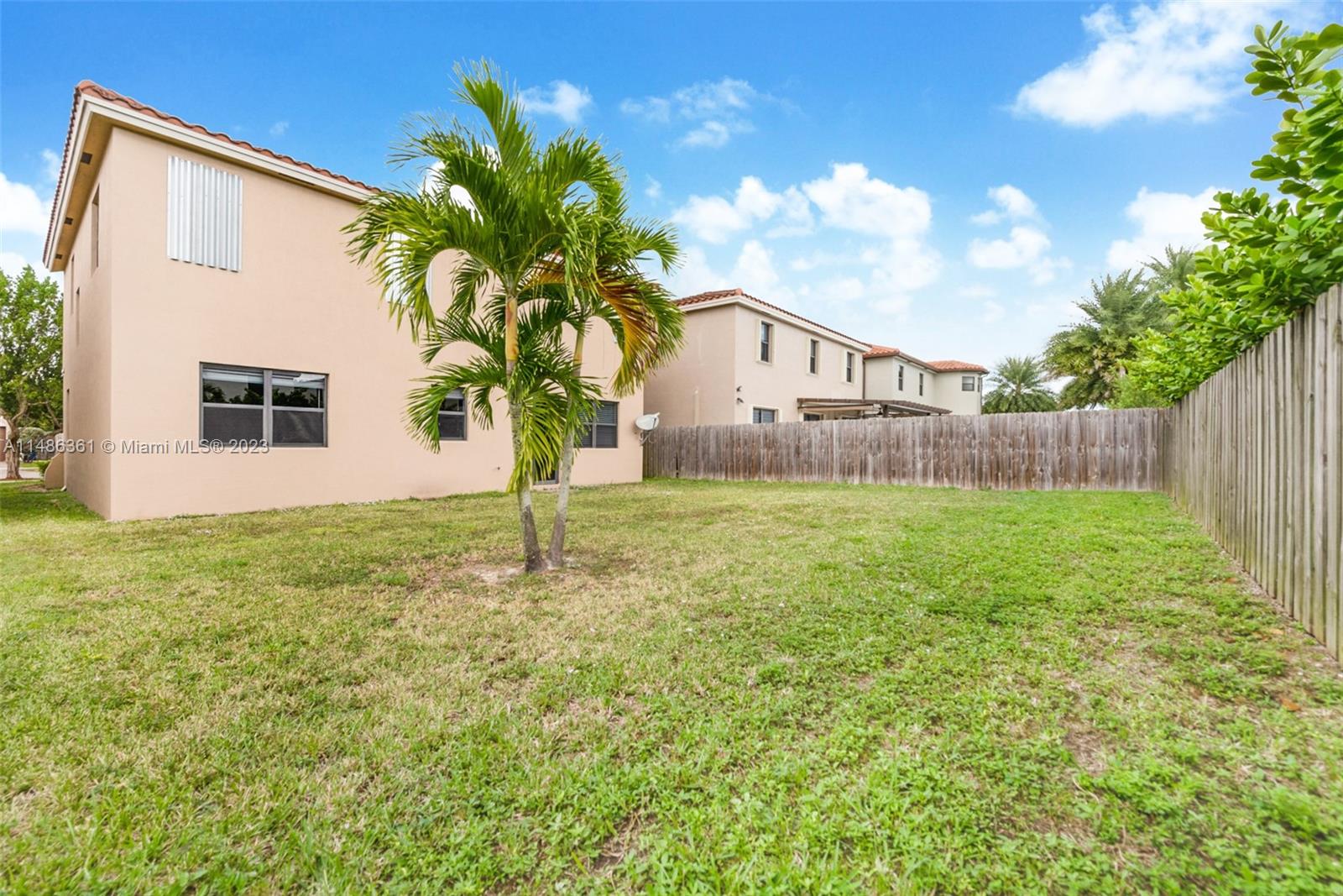 15218 Southwest 173rd Lane Miami, FL 33187 - Photo 14 of 14 a front view of a house with garden