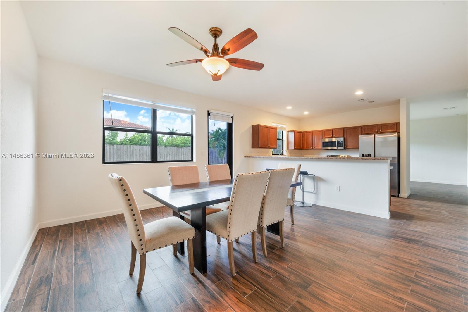 15218 Southwest 173rd Lane Miami, FL 33187 - Photo 2 of 14 a view of a dining room with furniture window and wooden floor