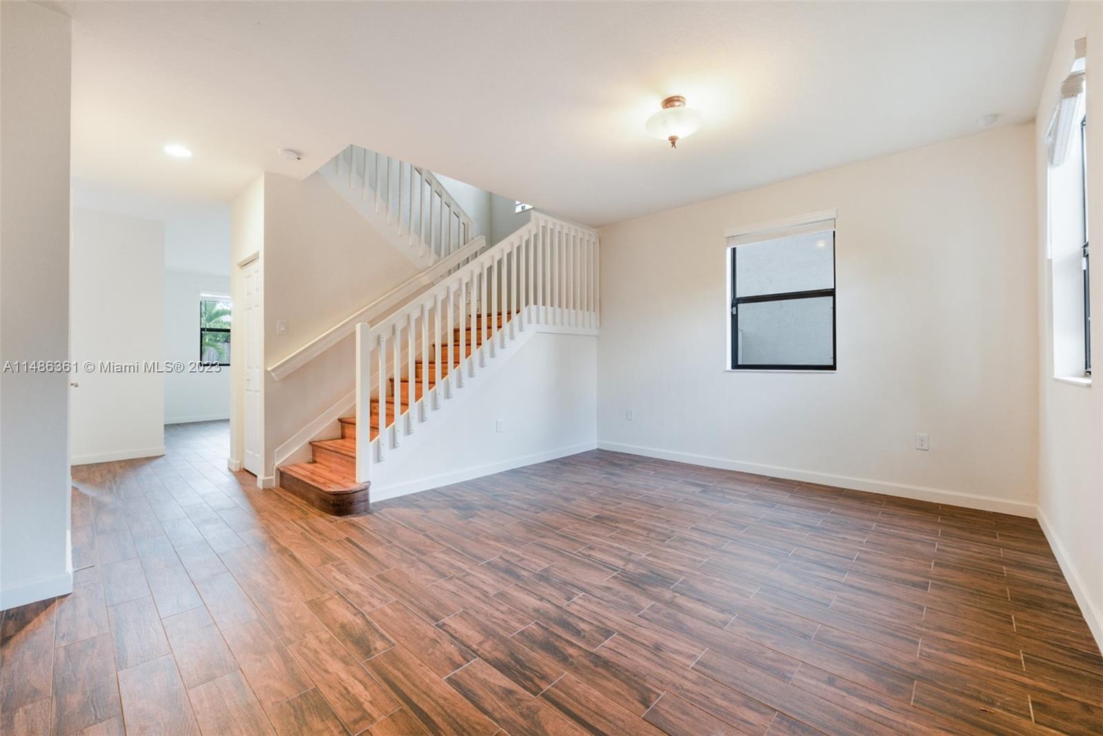 15218 Southwest 173rd Lane Miami, FL 33187 - Photo 3 of 14 a view of entryway and hall with wooden floor