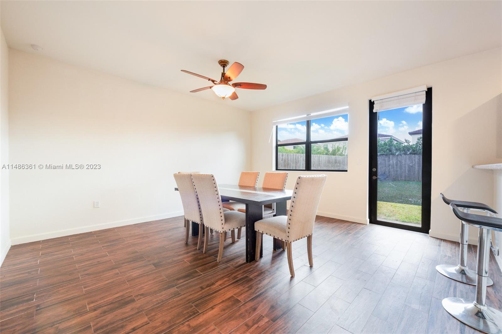 15218 Southwest 173rd Lane Miami, FL 33187 - Photo 4 of 14 a view of a dining room with furniture and wooden floor