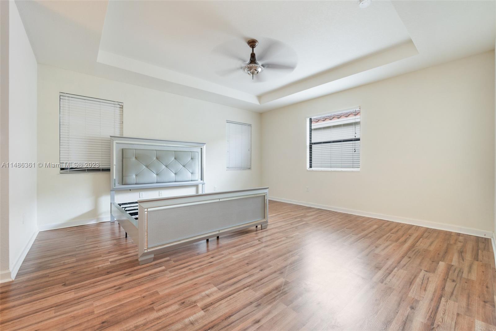 15218 Southwest 173rd Lane Miami, FL 33187 - Photo 7 of 14 a view of room with window and wooden floor