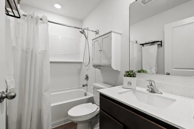 a bedroom with a bed and a book shelf