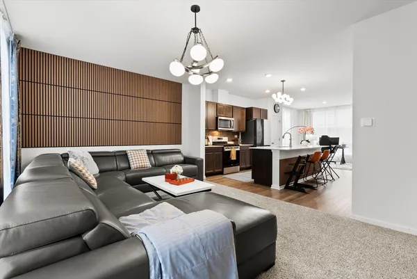 a living room with furniture kitchen and a kitchen view