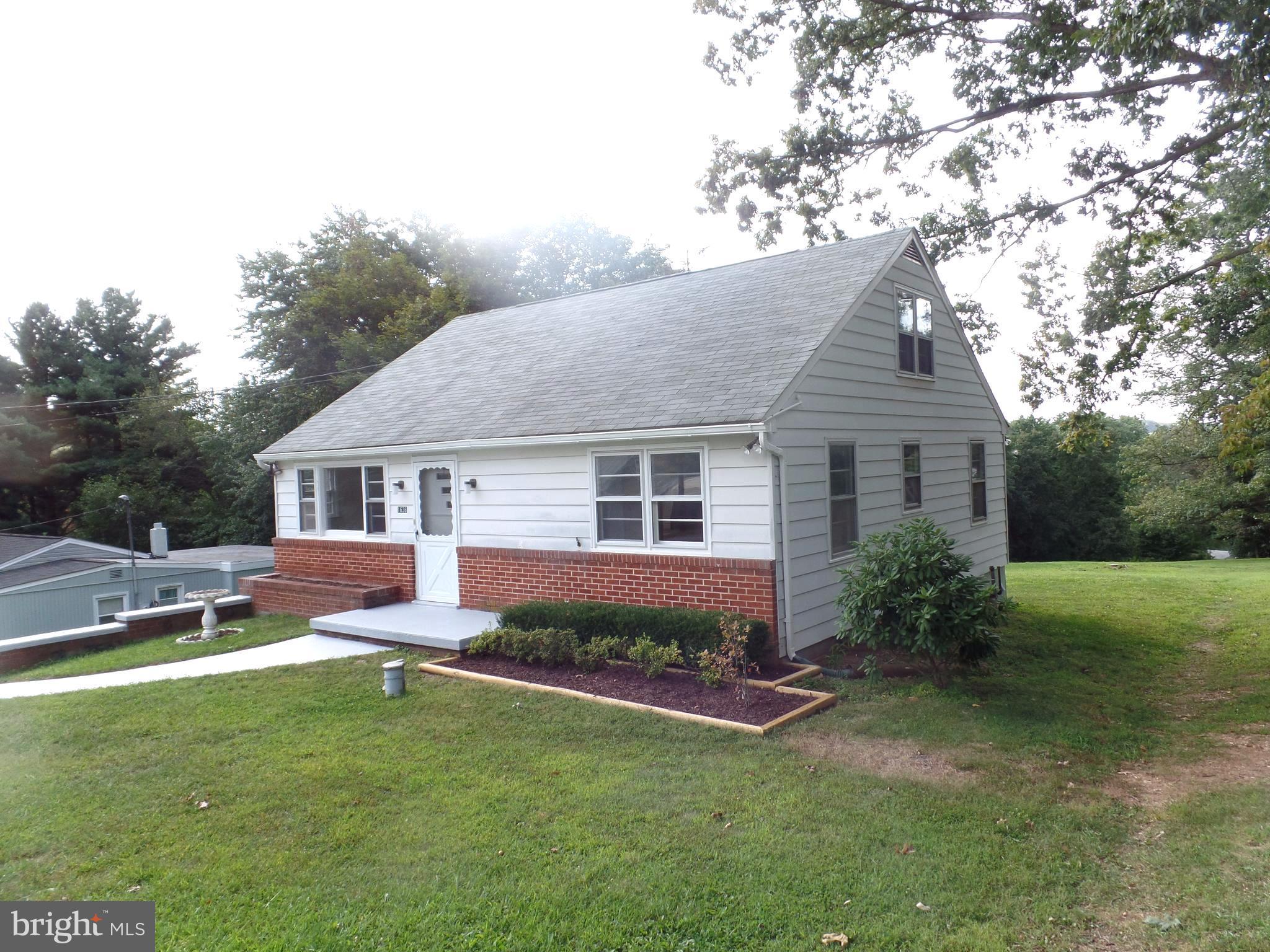 1636 Exeter Road Westminster, MD 21157 - Photo 1 of 23 a front view of a house with a garden and yard