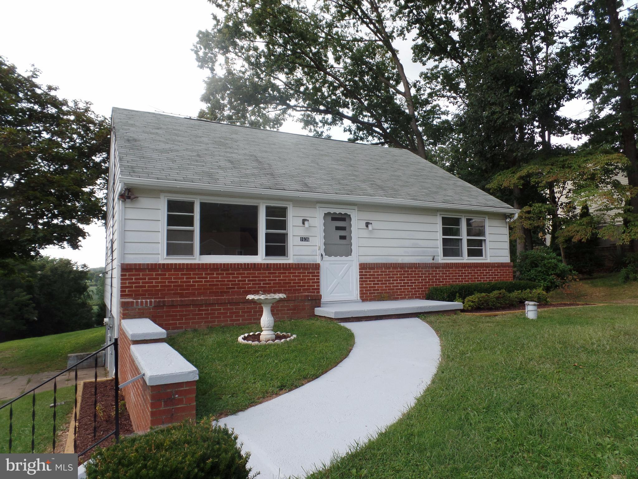 1636 Exeter Road Westminster, MD 21157 - Photo 2 of 23 a front view of a house with a yard and trees