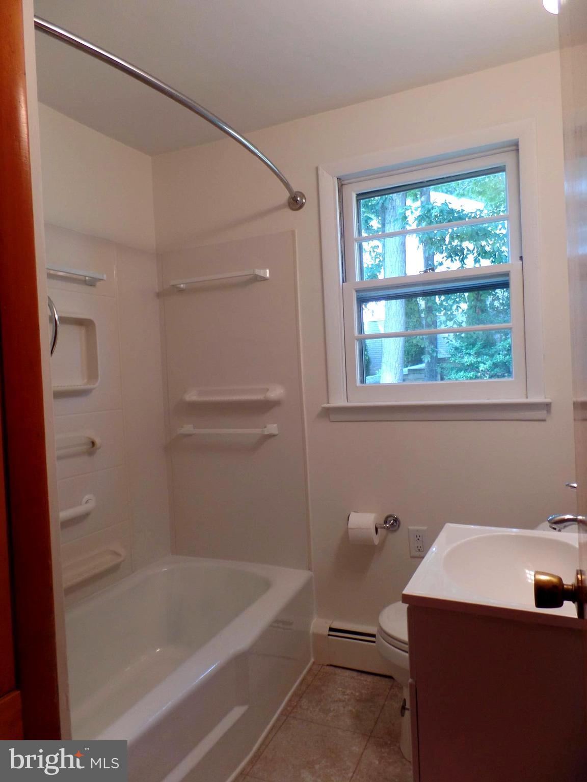 1636 Exeter Road Westminster, MD 21157 - Photo 12 of 23 a bathroom with a bathtub sink and vanity