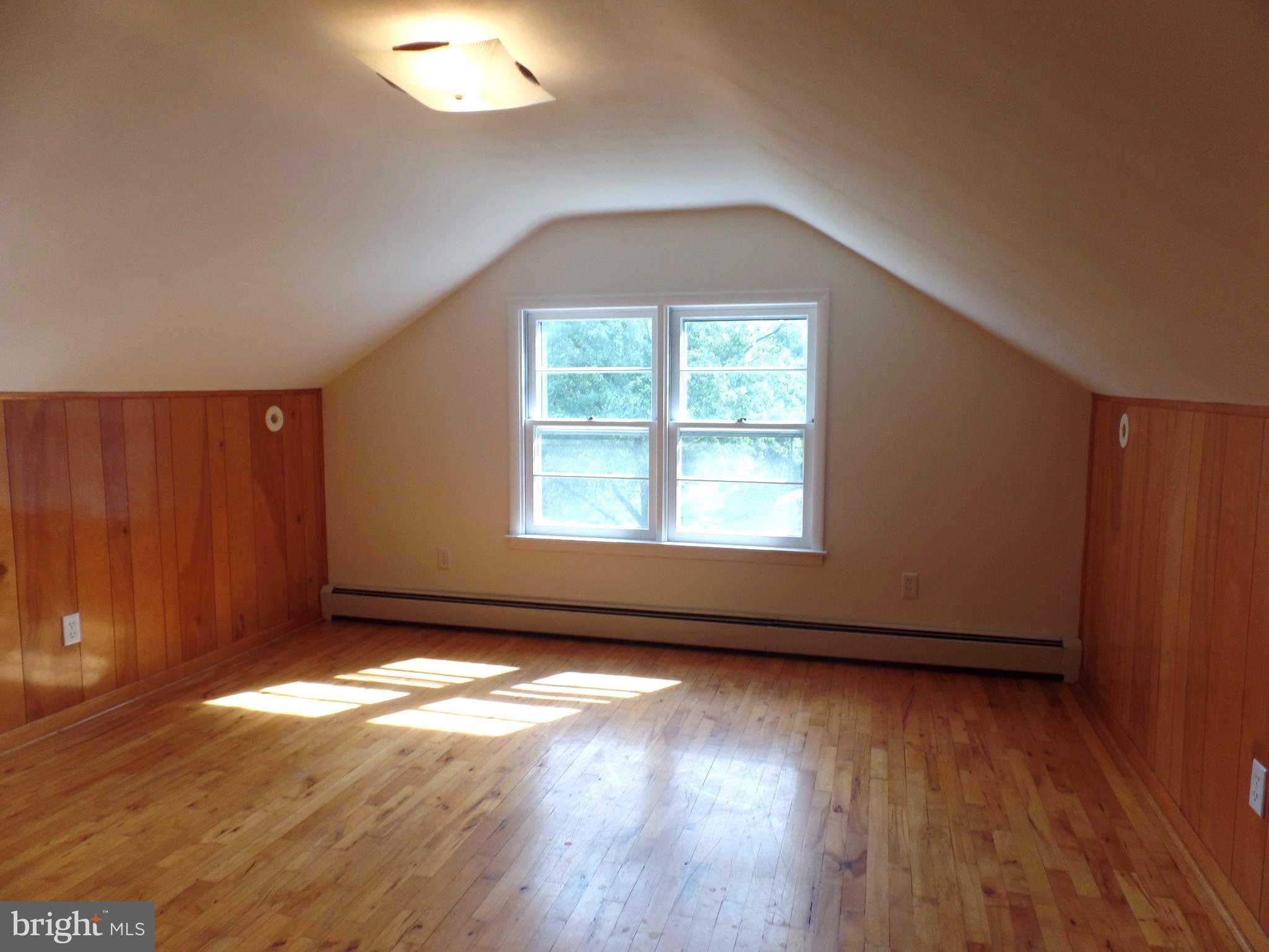 1636 Exeter Road Westminster, MD 21157 - Photo 14 of 23 an empty room with wooden floor and windows