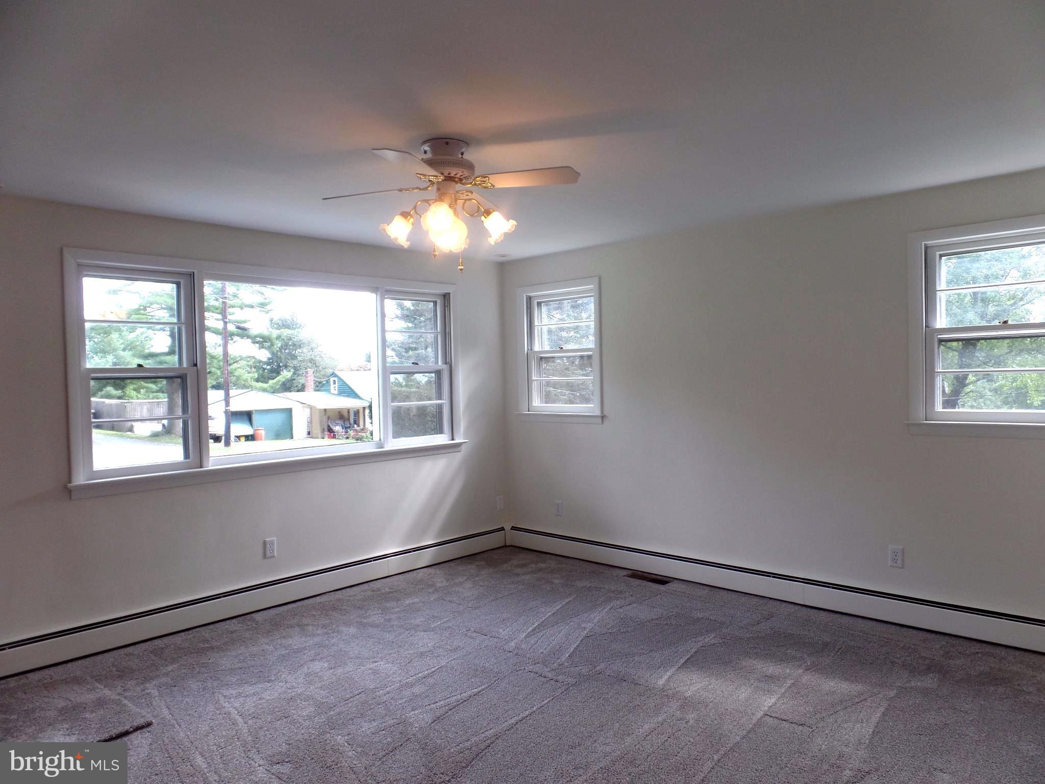 1636 Exeter Road Westminster, MD 21157 - Photo 4 of 23 a view of an empty room with a window