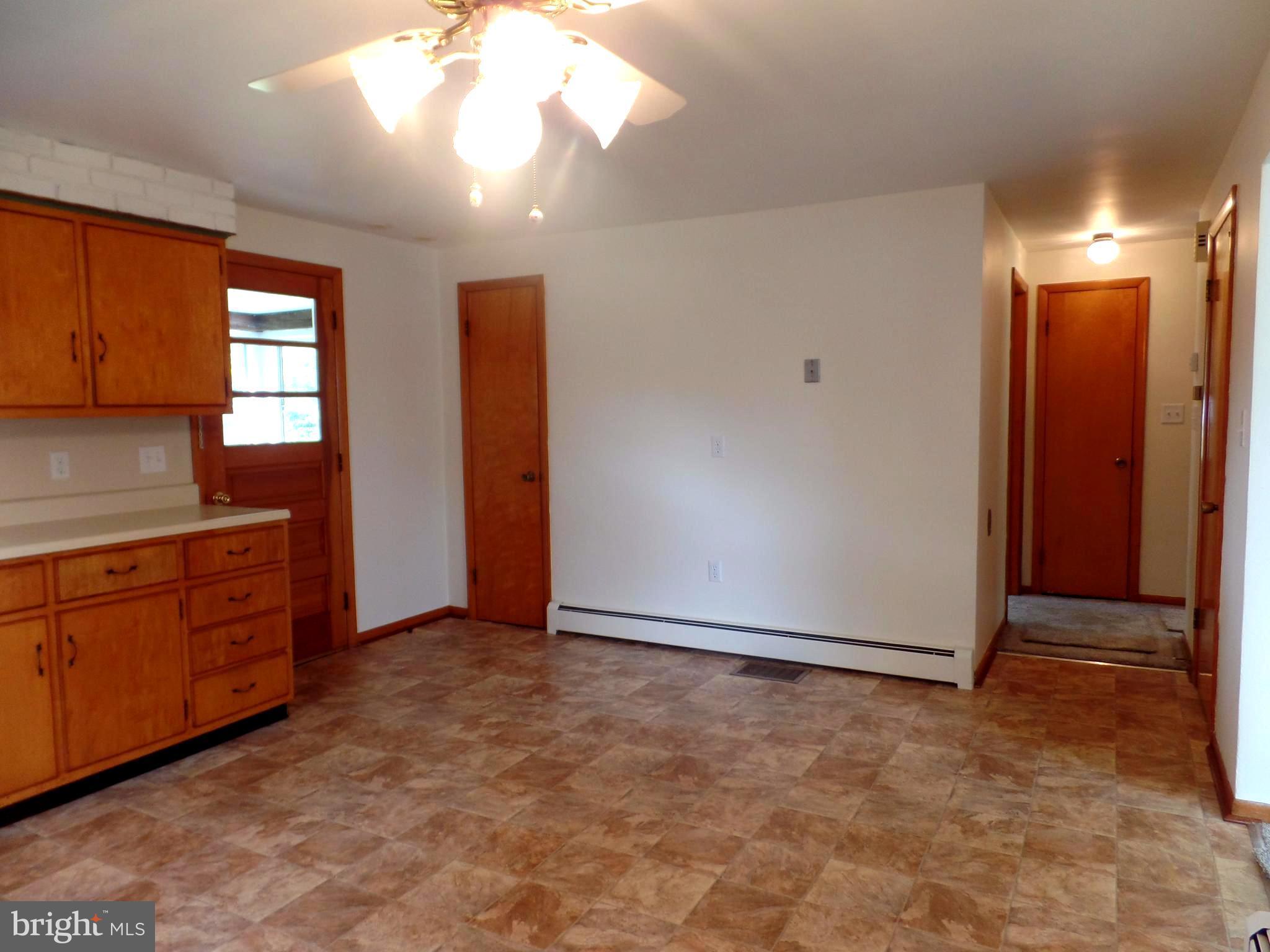 1636 Exeter Road Westminster, MD 21157 - Photo 6 of 23 a view of an empty room with window and cabinet